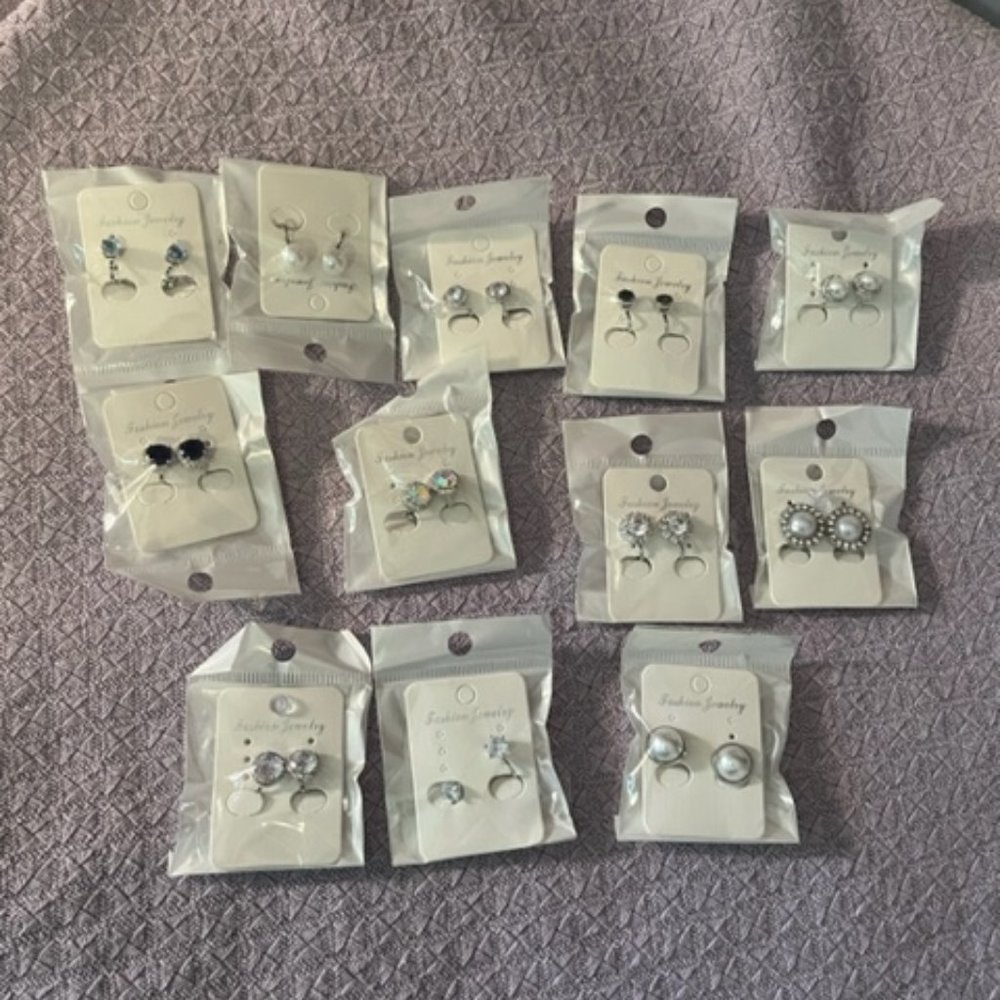 Clip on costume jewelry earrings. Never used. 12 pairs